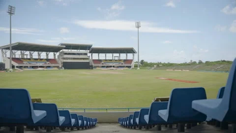Centered shot of a cricket stadium, with seats on either side and the Stock Footage 285151814