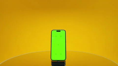 Centered smartphone green screen product mockup on yellow Stock Footage 334954369