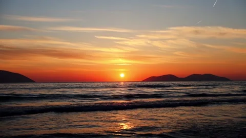 Centered Sun in Orange Sunset Sky Over Sea Stock Footage 331873325