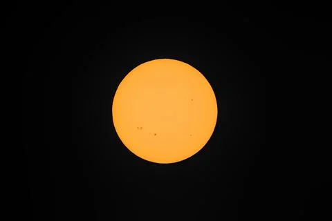 Centered view of the Sun with many active sunspot regions seen in Dublin Stock Photos