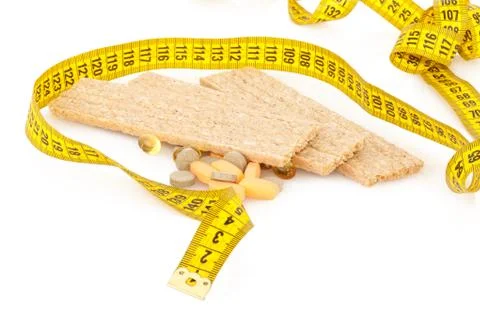 Centimeter, crispbread and tablets Stock Photos