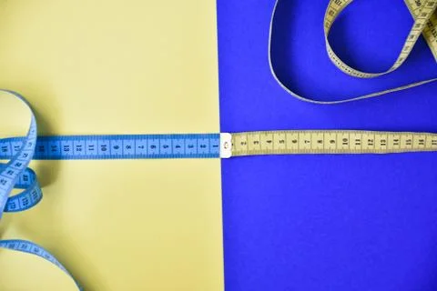 Centimeter tape on a colored background Stock Photos