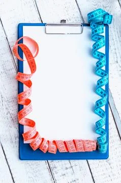 Centimeter tape, Notepad with space for text. the concept of health, weight.. Foto stock