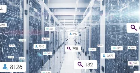 Central aisle running through data center, showing illuminated server racks and Stock Photos