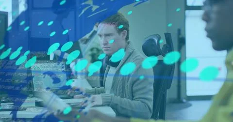 Central analyst typing, live data causing map and readouts sweeping across desk, Stock Photos