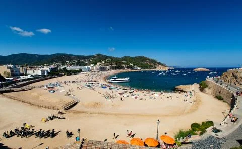Central beach in Tossa del Mar at noon Stock Photos