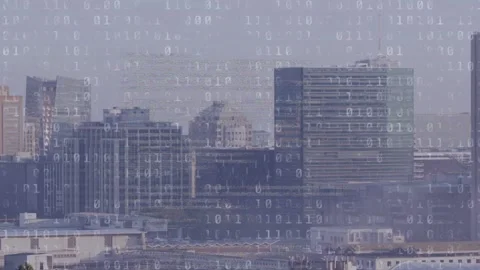 Central buildings being overlaid by scrolling code, overlay intensifying then Stock Footage 334000104