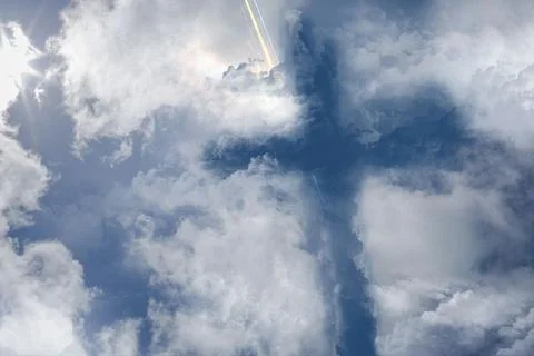 Central dense clouds forming cross shape are dominating flat design sky art with Stock Photos