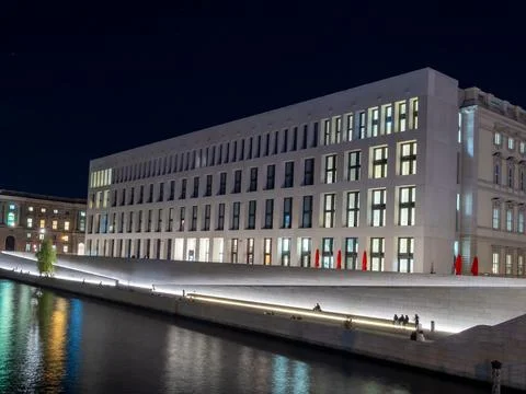 Central district at night, Berlin. Reflection of the city in the river. Stock Photos