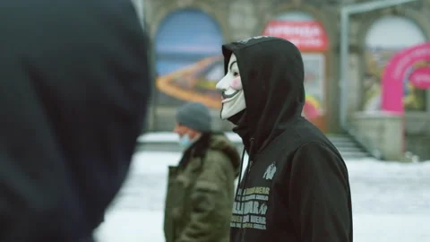 Central Europe protest activity. Anonymous masked Guy Fawkes riot supporter. Stock Footage 154391736