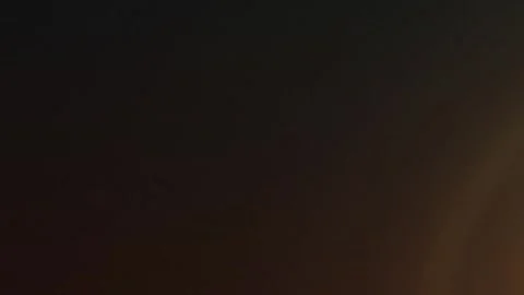 Central glowing light expanding in warm circular gradients Vídeo Stock 330120174