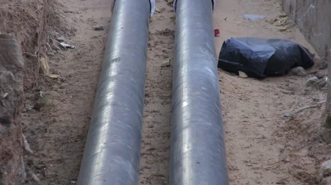 Central heating pipes going in the house Stock Footage 59080539