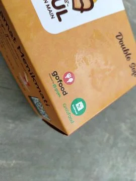 Central Java 14 April 2026: Food packaging featuring GoFood and GrabFood deliver 写真素材
