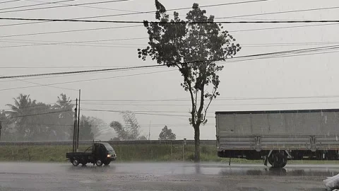 Central Java April 9 2026: Rainy day traffic jam with cars stuck in slow movemen 動画素材 332625822