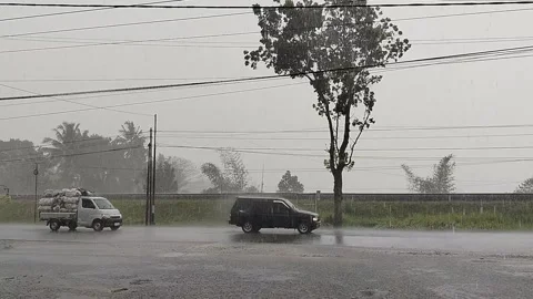 Central Java April 9 2026: Rainy day traffic jam with cars stuck in slow movemen 動画素材 332625825