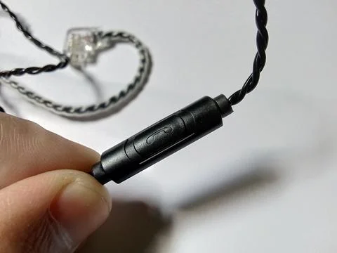 Central Java Indonesia 11 October 2023: closeup of a person holding a cable iem  Stock-Fotos