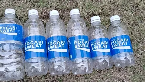 Central Java Indonesia 13 July 2026: Collection of empty isotonic sports drink  Vídeos de archivo 340120206
