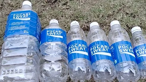 Central Java Indonesia 13 July 2026: Collection of empty isotonic sports drink  Video stock 340120209
