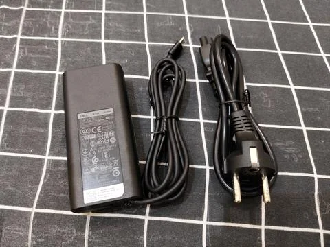 Central Java Indonesia 13 June 2026: A Dell laptop charger with AC power adapter Stock-Fotos