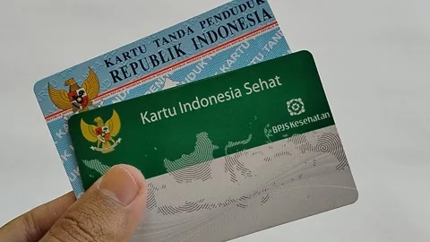 Central Java Indonesia 16 July 2026: Close-up of a hand holding an Indonesian Na Stock Footage 340120176