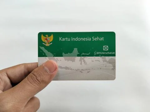 Central Java Indonesia 16 July 2026: Hand holding an Indonesian Health Card with Stock-Fotos