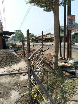 Central Java Indonesia 16 July 2026: Road construction site with piles of excava Stock-Fotos