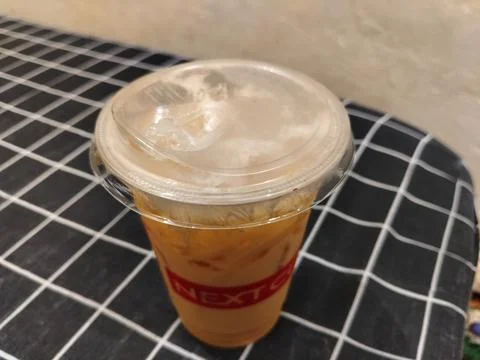 Central Java Indonesia 18 February 2026: Popular iced tea in a takeaway cup Fotos de archivo