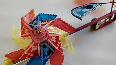 Central Java Indonesia 18 May 2026: Bright toy windmill designed for children,  Stock-Footage 336289394