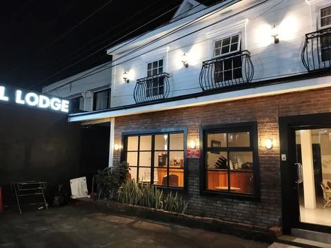 Central Java Indonesia 18 September 2026: Night exterior view of a rustic modern Stock Photos