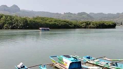 Central Java Indonesia 19 June 2026: A traditional wooden boat rests at the  Vídeos de archivo 338375670