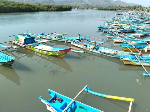 Central Java Indonesia 19 June 2026: A traditional wooden boat rests Stock Photos