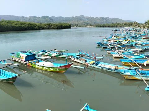 Central Java Indonesia 19 June 2026: A traditional wooden boat rests Stock Photos