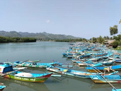 Central Java Indonesia 19 June 2026: A traditional wooden boat rests Stock Photos