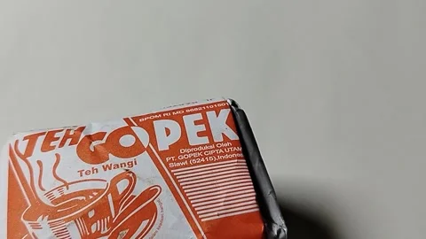 Central Java, Indonesia, 19 May 2026: An unopened pack of Teh Gopek Slawi, a tra Stock Footage 335191876