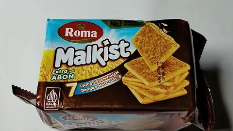 Central Java, Indonesia, 19 May 2026: Roma malkist crackers topped with savory  Stock Footage 335191911