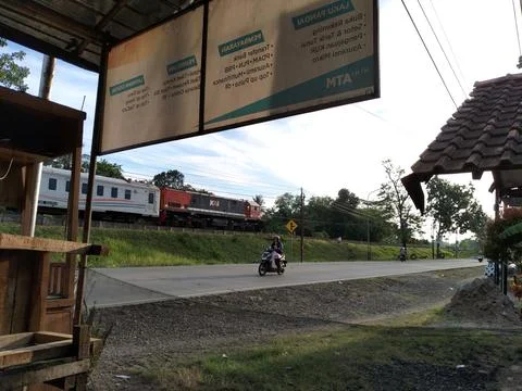 Central Java Indonesia 20 March 2026: Indonesian railway train passing on tracks Photos