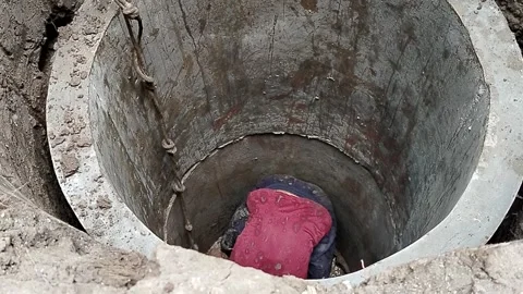 Central Java Indonesia 23 July 2026: Traditional hand-dug water well excavation  Stock Footage 340330971
