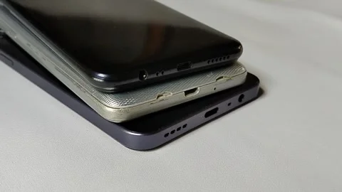 Central Java Indonesia 23 March 2026: Multiple smartphones stacked together. Video stock 332067042