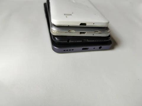 Central Java Indonesia 23 March 2026: Multiple smartphones stacked Stock Photos