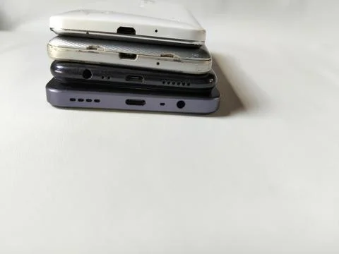 Central Java Indonesia 23 March 2026: Multiple smartphones stacked Stock Photos