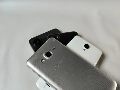 Central Java Indonesia 23 March 2026: Multiple smartphones stacked Stock Photos