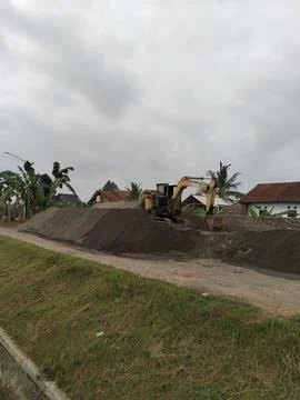 Central Java Indonesia 25 June 2026: excavator working in a sand quarry Stock Photos