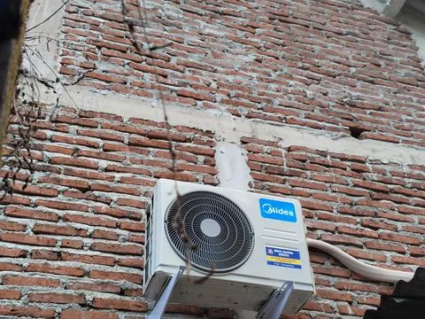Central Java Indonesia 27 May 2026: Outdoor air conditioner condenser unit Фото