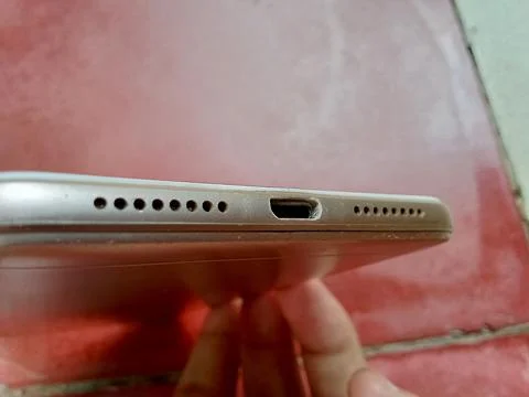 Central Java Indonesia 27 October 2024: usb hole and speaker on smartphone. Фото
