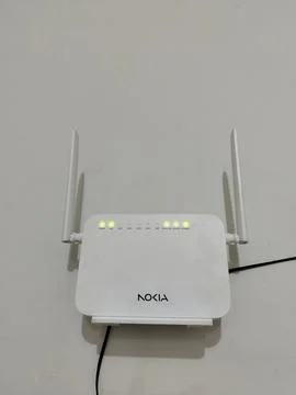 Central Java Indonesia 28 March 2026: Nokia WiFi router mounted on wall, active  스톡 사진