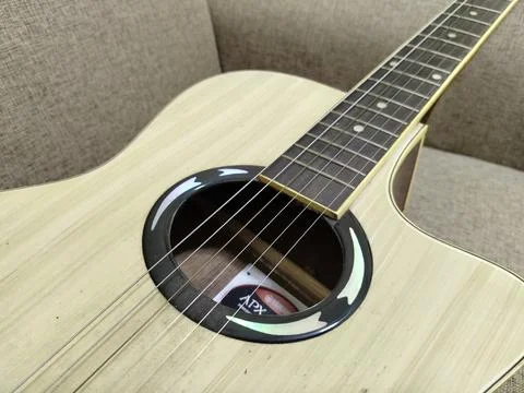 Central Java Indonesia 4 August 2026: A light wooden Yamaha APX series acoustic  Fotos de archivo