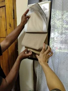 Central Java Indonesia 5 August 2026: Customer and seller examining the texture  Stock-Fotos