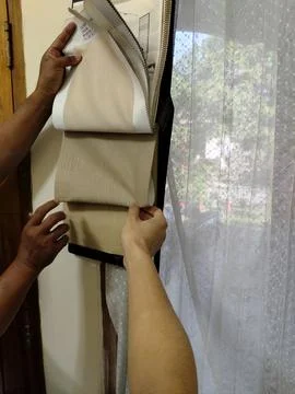 Central Java Indonesia 5 August 2026: Customer and seller examining the texture  Stock-Fotos