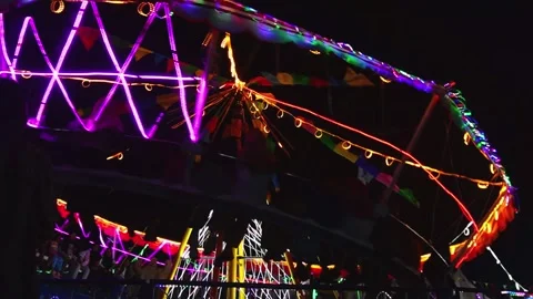 Central Java, Indonesia. April 15,2024: Slowmo rides the glittering night Stock Footage 274828788