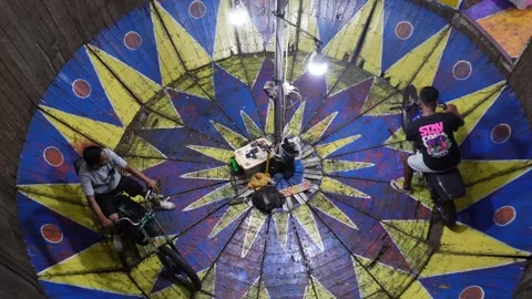 Central Java, Indonesia. April 15,2024: Two men are preparing to do a motor Stock Footage 274829840